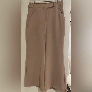 Petite/short Beige high rise flare trousers.